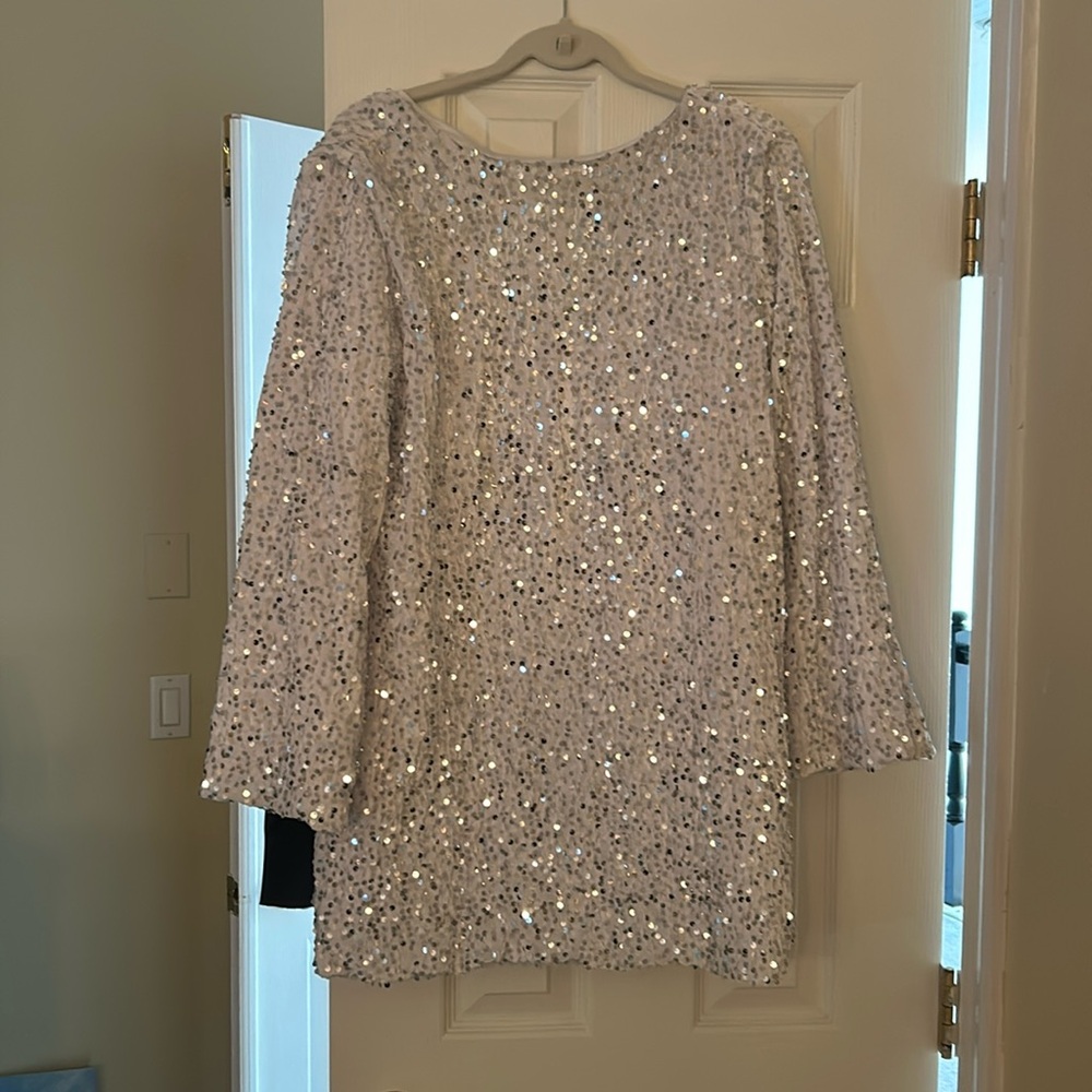 New - unworn. White sequin dress with back tie